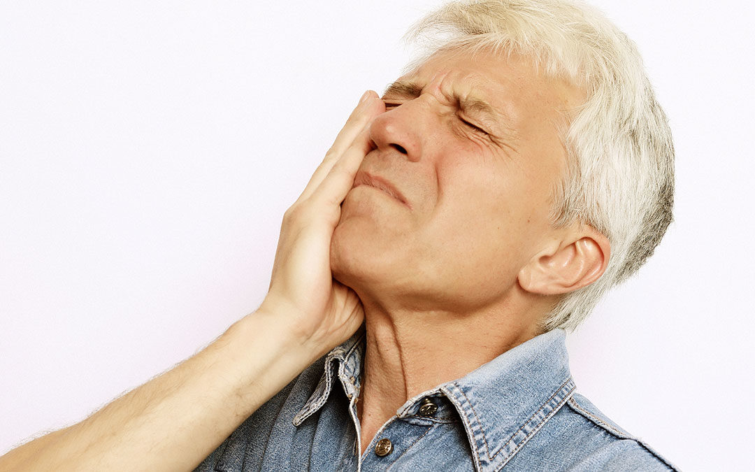 Man with toothache or other dental emergency