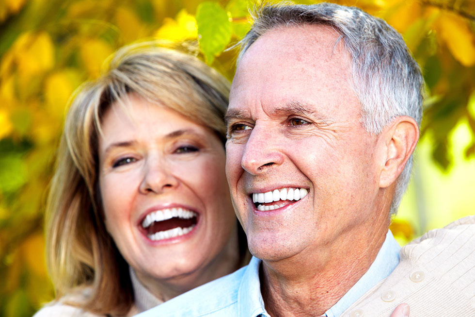 Woman and man with dental implants in Oakbrook, IL