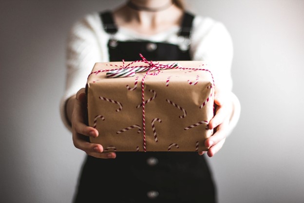 woman holding a wrapped gift
