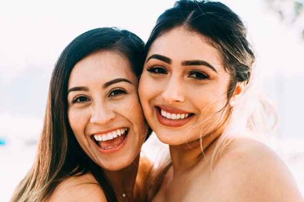 Two women smile after getting teeth whitening in Oakbrook Terrace, IL