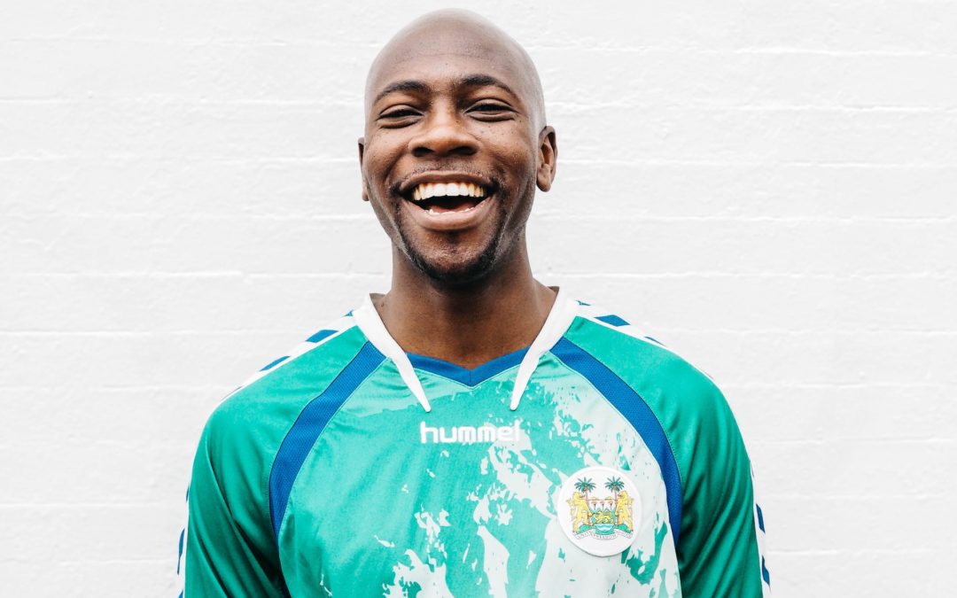 A Black man smiles widely after a teeth cleaning in Oakbrook Terrace, IL